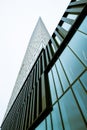 Looking up a tall scyscraper glass facade.. Royalty Free Stock Photo