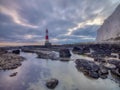 Looking up to Beachy Head light and cliff - a stitched panorama processed with HDR technology - taken from below the light house Royalty Free Stock Photo