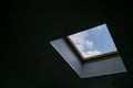 Looking up to the blue cloudy sky through modern square ceiling window Royalty Free Stock Photo