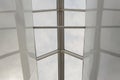 Looking up to the blue cloudy sky through modern square ceiling window. Royalty Free Stock Photo