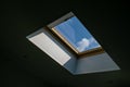 Looking up to the blue cloudy sky through modern square ceiling window Royalty Free Stock Photo