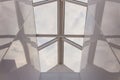 Looking up to the blue cloudy sky through modern square ceiling window. Royalty Free Stock Photo