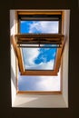 Looking up to the blue cloudy sky through modern square window Royalty Free Stock Photo