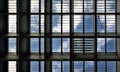 Looking up to the blue sky with clouds through roof windows Royalty Free Stock Photo