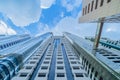 Looking up to high-rise office buildings, skyscrapers, architectures in financial district with blue sky. Smart urban city for Royalty Free Stock Photo