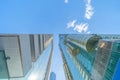 Looking up to high-rise office buildings, skyscrapers, architectures in financial district with blue sky. Smart urban city for Royalty Free Stock Photo