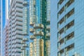 Looking up to high-rise office buildings, skyscrapers, architectures in financial district with blue sky. Smart urban city for Royalty Free Stock Photo