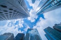 Looking up to high-rise office buildings, skyscrapers, architectures in financial district. Smart urban city for business and Royalty Free Stock Photo