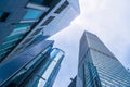 Looking up to high-rise office buildings, skyscrapers, architectures in financial district. Smart urban city for business and Royalty Free Stock Photo