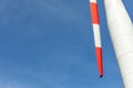 CLose-up of a wing of a wind turbine against blue sky Royalty Free Stock Photo