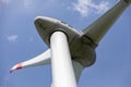 CLose-up of head of wind turbine against blue sky Royalty Free Stock Photo