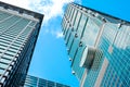 Looking up view of Taipei 101, the landmark of Taiwan, reflect blue sky and sun lights