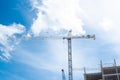 Looking up view working cranes at construction site of high-rise hotels, office building, skyscraper, unfinished commercial real Royalty Free Stock Photo