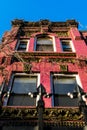 Looking up at the vine-covered facade of an old Harlem brownstone building, Manhattan, New York City, NY, USA Royalty Free Stock Photo