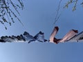 Looking up at a washing line of clothes