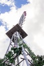 Looking up at a weather vane