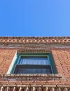 Looking up at a window in an old brick building. Royalty Free Stock Photo