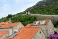 Looking upwards from the old croatian town of Ston at the ancient Walls of Ston in the forested mountains above beautiful Ston