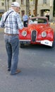 Looking at a vintage red jaguar motor car