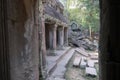 Looking through a window on ancient, crumbling stone temple ruins of angkor wat, cambodia