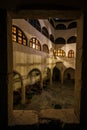 Looking Through Window of Castle Matzen over Modern Medieval Courtyard