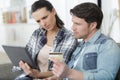 Looking worried couple buying online Royalty Free Stock Photo