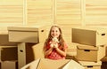 Looking for your next home. purchase of new habitation. happy little girl. Cardboard boxes - moving to new house. Moving Royalty Free Stock Photo