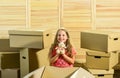 Looking for your next home. purchase of new habitation. happy little girl. Cardboard boxes - moving to new house. Moving Royalty Free Stock Photo