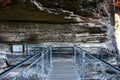 Lookout bridge towards Three Sister at hiking trail of Grand Stairway along steep shear rock cliff in Blue Mountains National Park Royalty Free Stock Photo