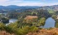 Lookout on the Nora river, surrounded by forests and trees. Mountains and hills at the background. Water meanders near PriaÃÂ±es, Royalty Free Stock Photo