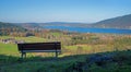 Lookout point with bench, lake view tegernsee, bavarian landscape Royalty Free Stock Photo