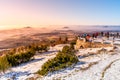 Lookout terrace at Jested Mountain Hotel. Sunny winter day view of tourists and foggy landscape. Liberec, Czech Republic