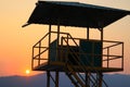 Lookout tower and colorful orange sunset