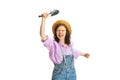 Excited young girl, gardener in work uniform and hat posing isolated on white background. Concept of job, emotions Royalty Free Stock Photo