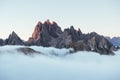 Looks like a heaven. The peaks of the mountains stifle from a going thick fog. Unbelievable photo takes