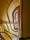 Lookup to spiral staircase in old tenement house Royalty Free Stock Photo