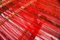 Loom strung with red threads for weaving Royalty Free Stock Photo