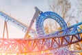 Loop and turn on a blue roller coaster in an amusement park