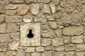 Loophole in medieval masonry stone fortress