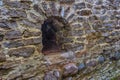 Loophole in the stone medieval wall Royalty Free Stock Photo
