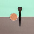 Loose face powder with make-up brush. Top view, flatlay