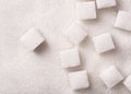 Loose granulated sugar and cubes close-up