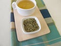 Loose kukicha green tea and cup of tea Royalty Free Stock Photo