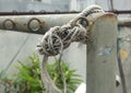 Loose rope on steel fence Royalty Free Stock Photo