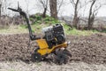 Loosens the soil cultivator side view Royalty Free Stock Photo