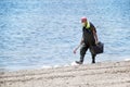 Lopagan, Murcia, Spain, May 20, 2020: Retired volunteer seniors clean the Mar Menor, the Europe's biggest salt water lagoon