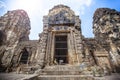 Lopburi Thailand. Monkey Crab-eating or Long-tailed macaque in Prang Sam Yot temple. Khmer ancient Buddhist pagoda ruins are