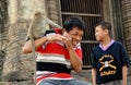 Lopburi, Thailand: Monkey Sitting on Man's Shoulder