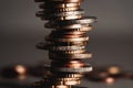 A lopsided, chaotic pile of coins. Close-up of euro coins with blurred background, soft focus