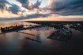 Lorain harbor with the sun rising to the east, with clouds and reflections in the water